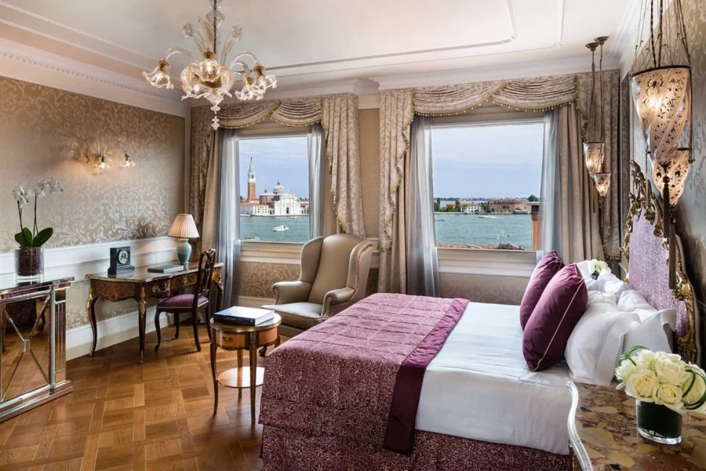 Elegant room with Venetian lagoon views at Baglioni Hotel Luna in Venice