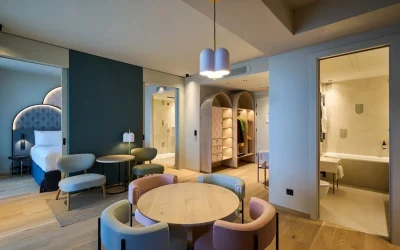 Spacious modern family suite with a separate sleeping area, dining space and contemporary bathroom, Cavallino Bianco Caorle, Caorle.