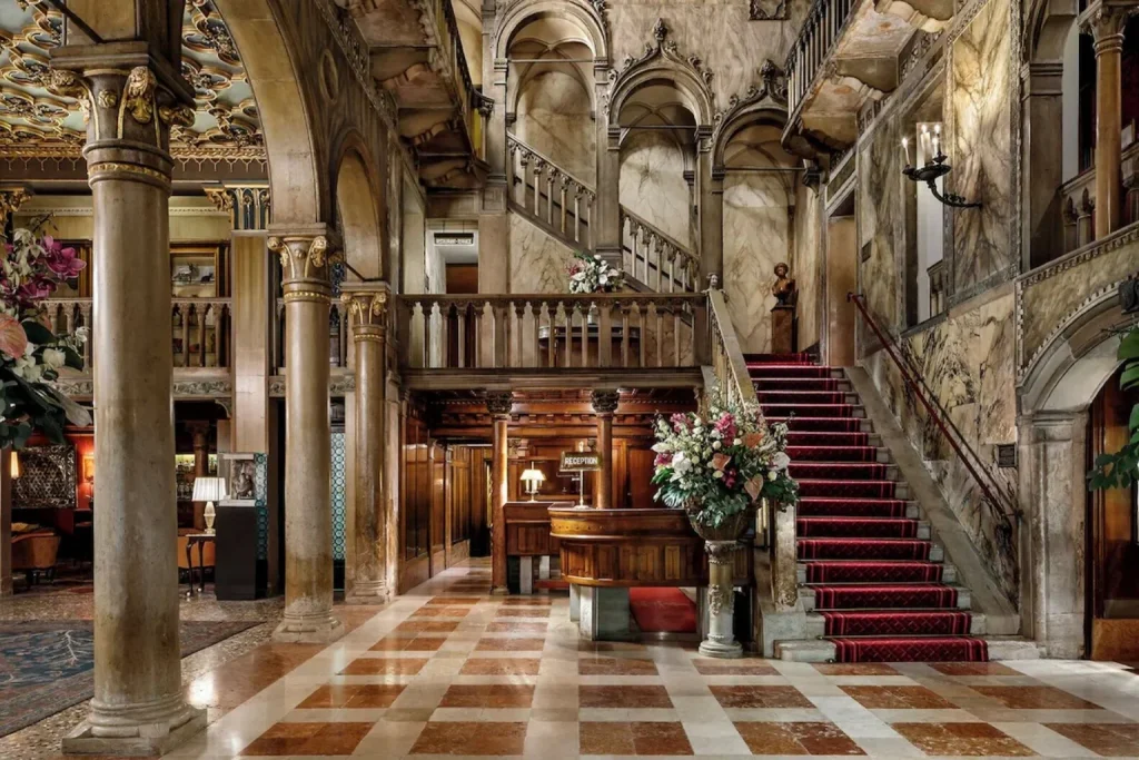 Magnificent historic lobby with marble columns, an ornate staircase and richly detailed Venetian architecture, Danieli, A Four Seasons Hotel, Venice.