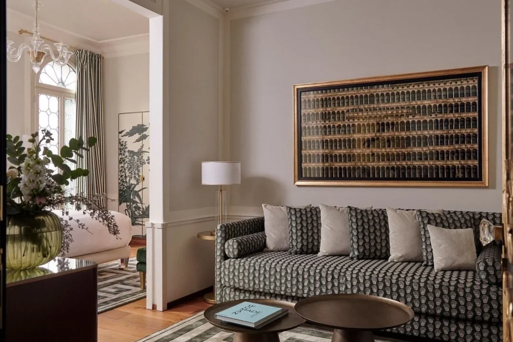 Elegant suite room with a comfortable living area, patterned sofa and refined contemporary décor, Hotel Atmosphere, Venice.