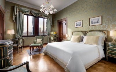 Elegant bedroom with classic Venetian decor and city views at Hotel Danieli, a Four Seasons Hotel in Venice