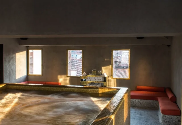 Indoor spa pool with golden mosaic tiles at Nolinski Venezia – Evok Collection in Venice