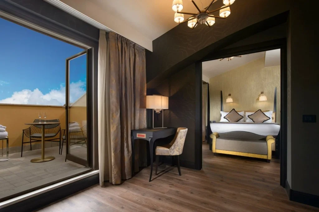 Luxury suite with private terrace and elegant bedroom at Palazzo Veneziano in Venice
